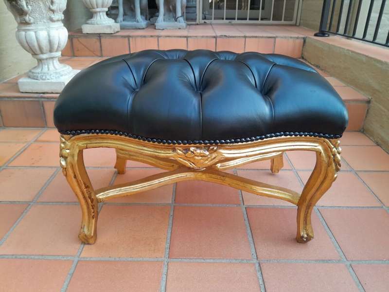 A French Style Giltwood Ottoman / Tuffet / Stool Upholstered in Deep Buttoned Leather