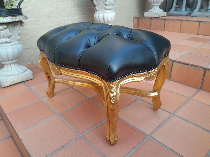 A French Style Giltwood Ottoman / Tuffet / Stool Upholstered in Deep Buttoned Leather
