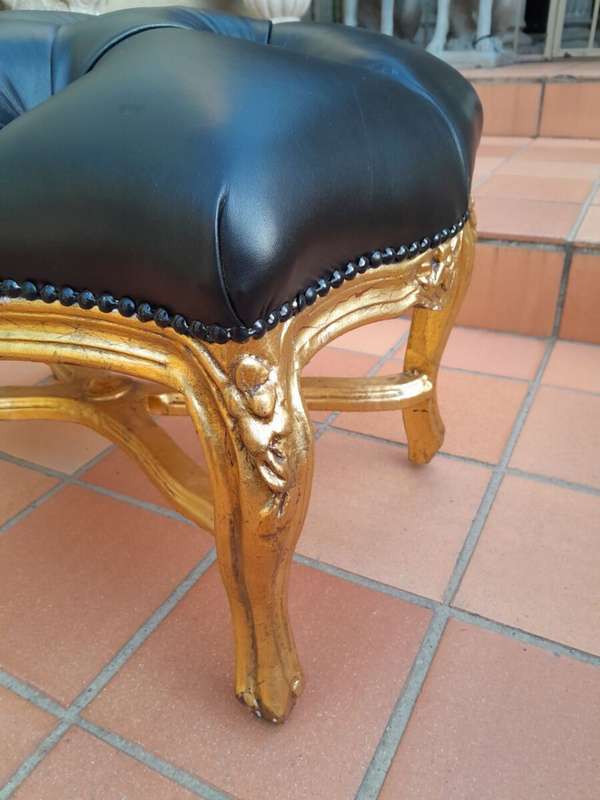 A French Style Giltwood Ottoman / Tuffet / Stool Upholstered in Deep Buttoned Leather
