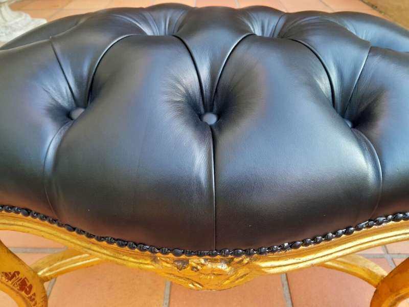 A French Style Giltwood Ottoman / Tuffet / Stool Upholstered in Deep Buttoned Leather