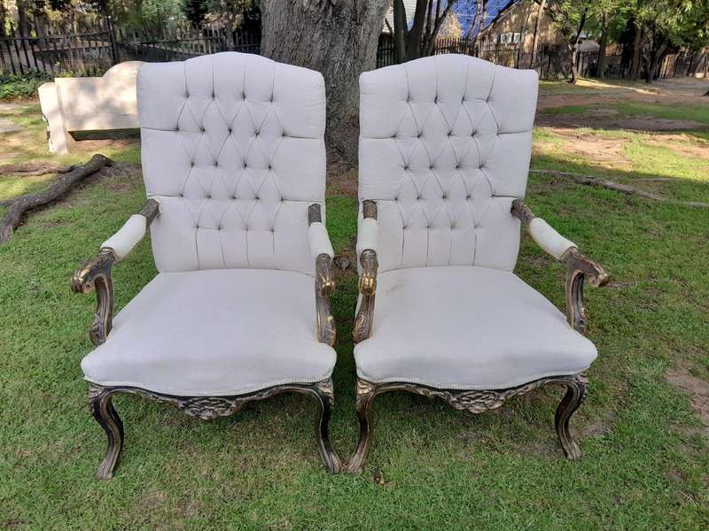 A 20th Century Pair Of French Style Carved And Giltwood High-Back Chairs In Leather