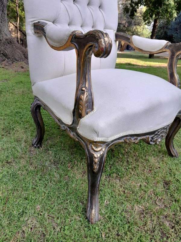 A 20th Century Pair Of French Style Carved And Giltwood High-Back Chairs In Leather