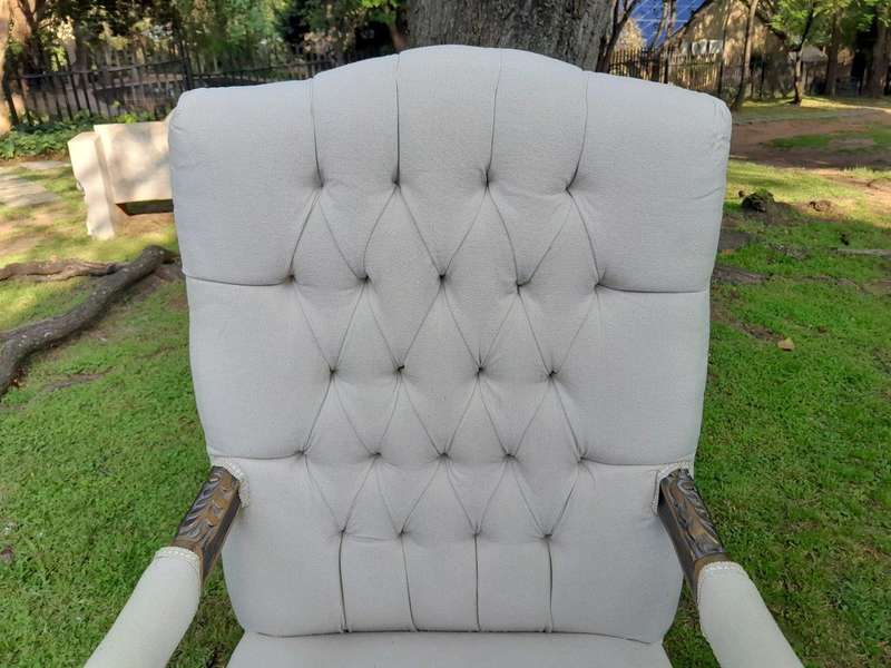 A 20th Century Pair Of French Style Carved And Giltwood High-Back Chairs In Leather