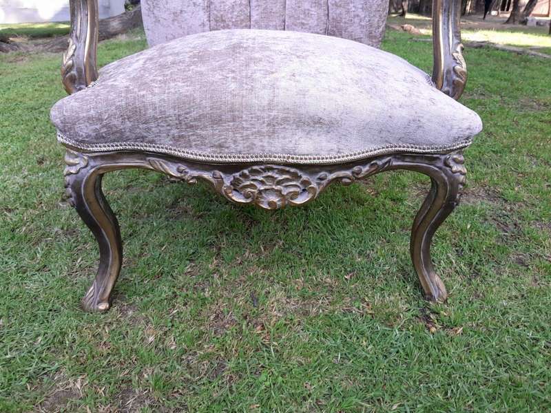 A 20th Century Pair Of French Style Carved And Giltwood High-Back Chairs In Leather