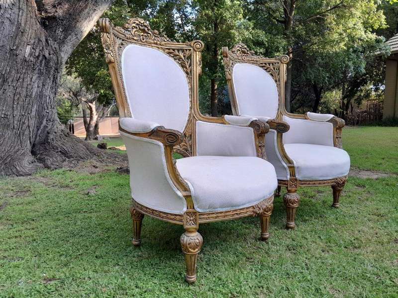 A Pair Of French Style Giltwood Ornate Arm Chairs
