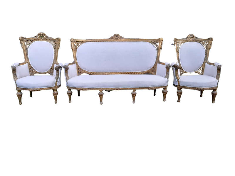 A French Style Giltwood Ornately Carved Settee With A Pair Of Matching Armchairs