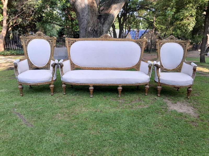 A French Style Giltwood Ornately Carved Settee With A Pair Of Matching Armchairs