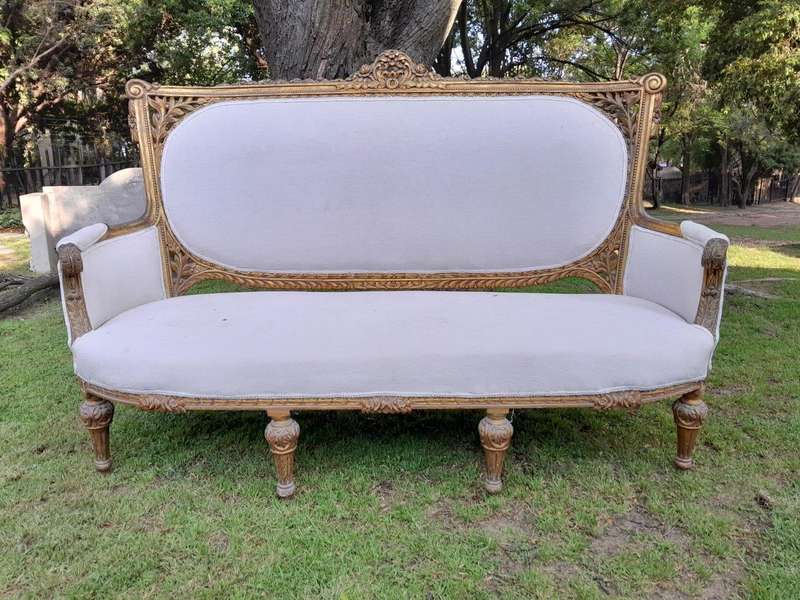 A French Style Giltwood Ornately Carved Settee With A Pair Of Matching Armchairs