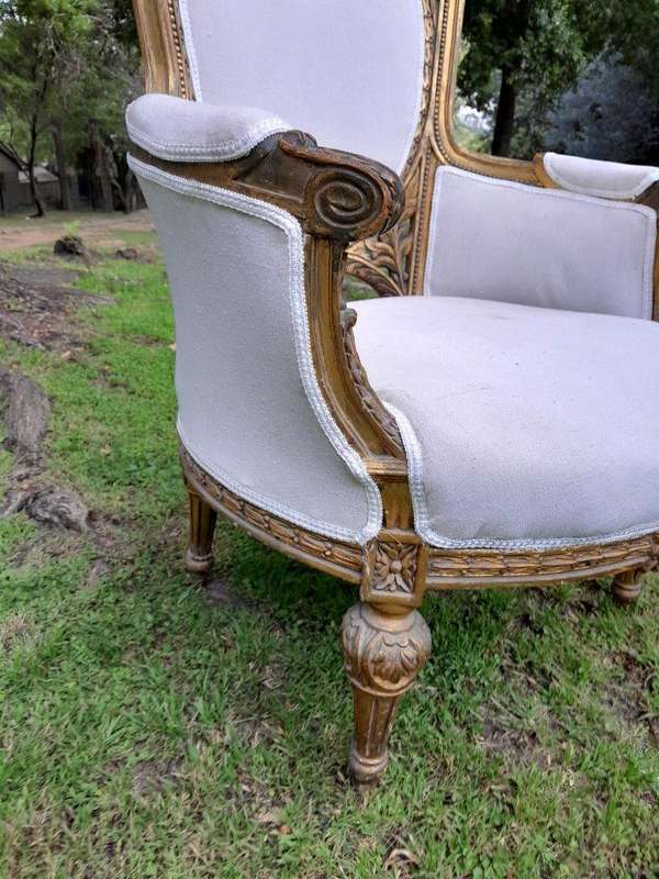 A French Style Giltwood Ornately Carved Settee With A Pair Of Matching Armchairs