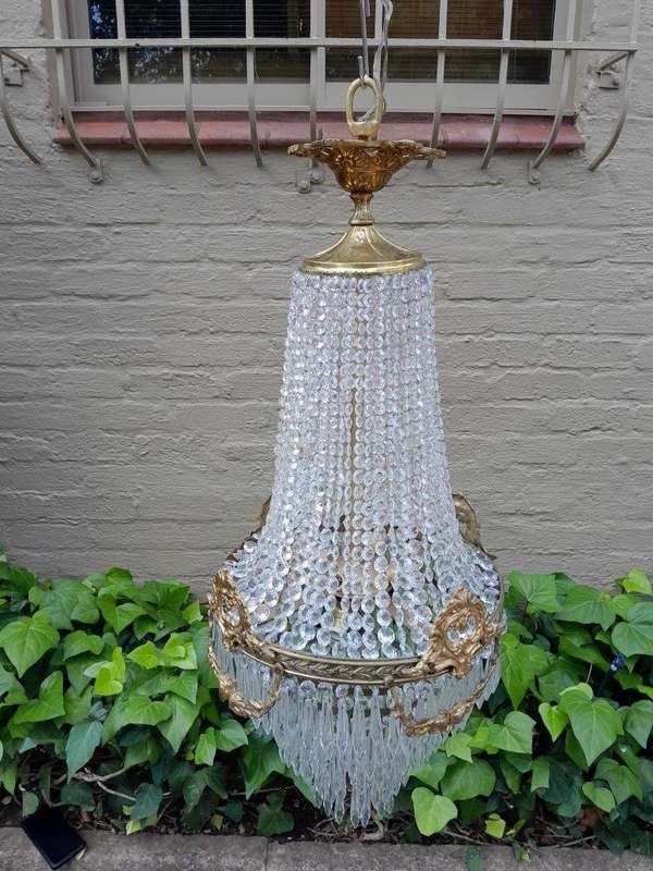 A 20th Century Empire French Style Brass And Crystal Chandelier