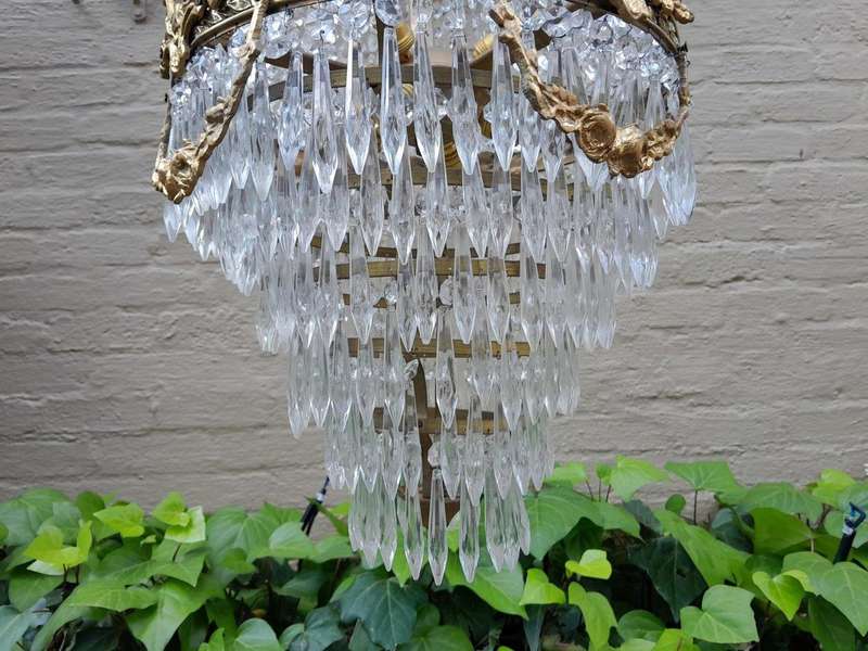 A 20th Century Empire French Style Brass And Crystal Chandelier