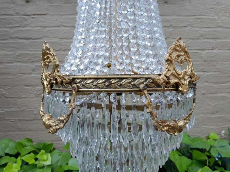 A 20th Century Empire French Style Brass And Crystal Chandelier