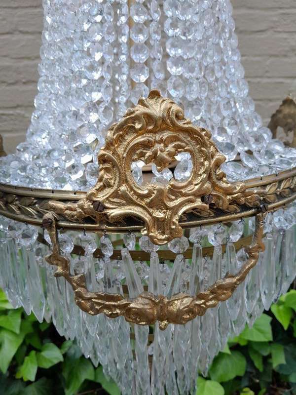 A 20th Century Empire French Style Brass And Crystal Chandelier