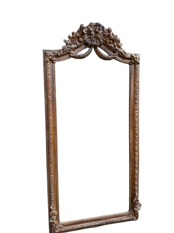 A French Rococo Style Ornately Carved And Gilded Bevelled Mirror