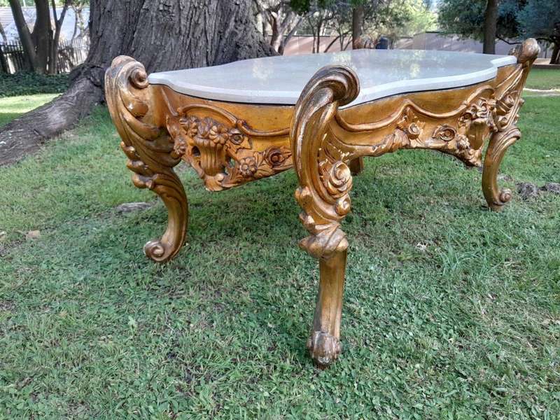 A French Style Ornately Carved Coffee Table with Marble Top