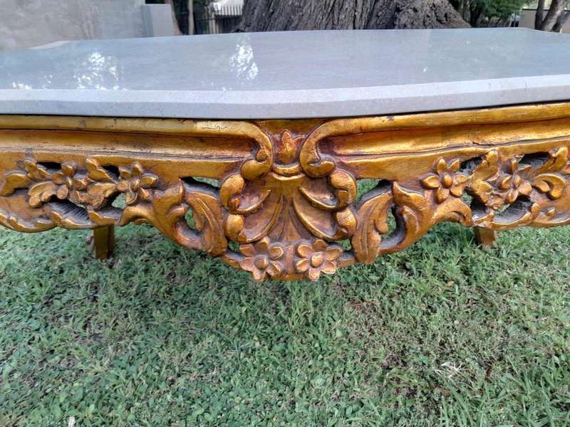 A French Style Ornately Carved Coffee Table with Marble Top