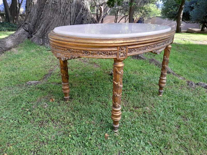 A French Style Ornately Carved Oval Coffee Table With Marble Top
