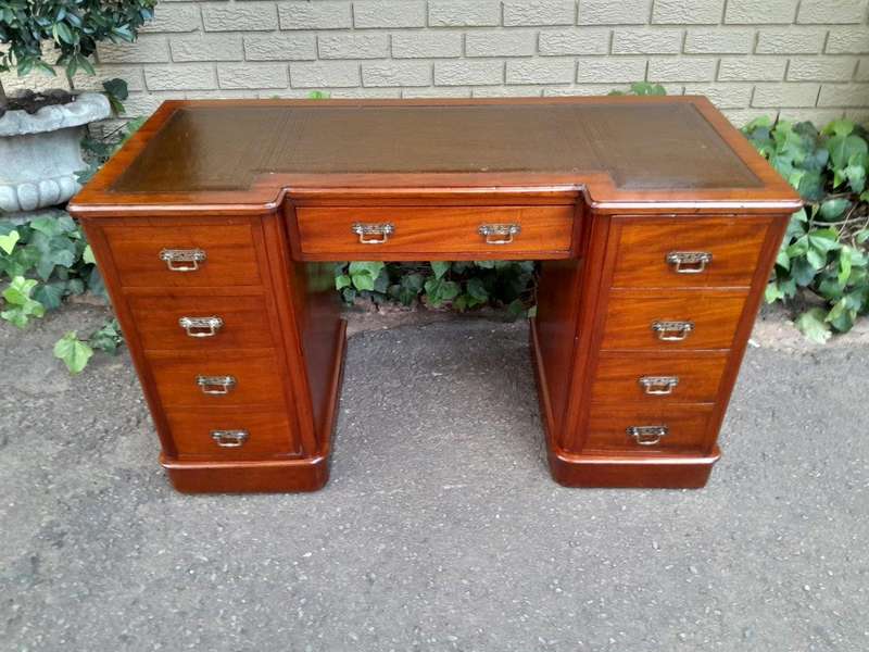 An Antique Victorian Mahogany Desk With Tooled Leather Top