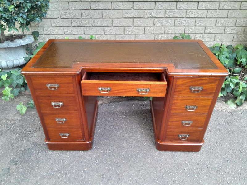 An Antique Victorian Mahogany Desk With Tooled Leather Top