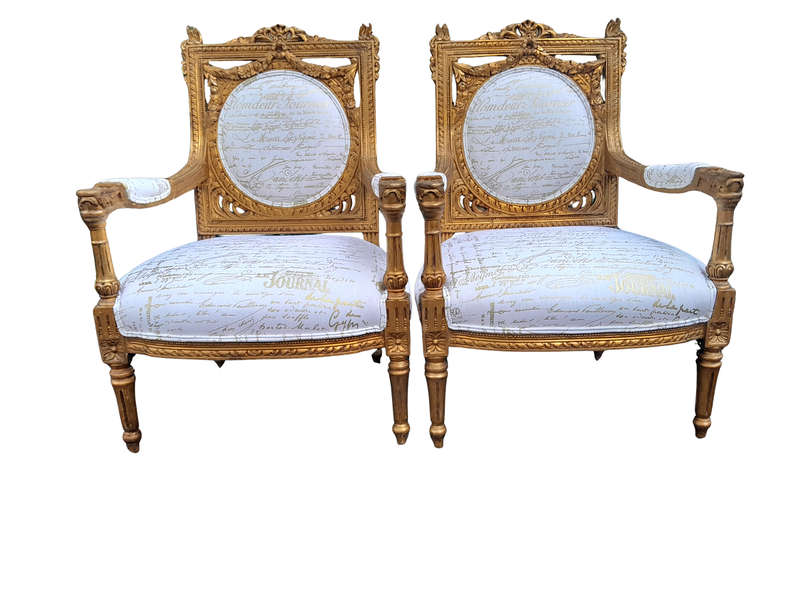 A 20th Century Pair Of French Ornately Carved And Gilded Armchairs