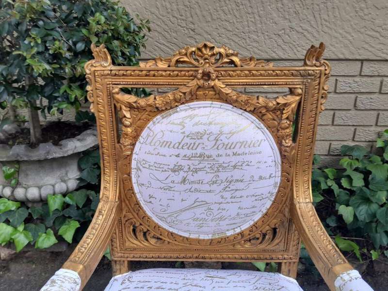 A 20th Century Pair Of French Ornately Carved And Gilded Armchairs