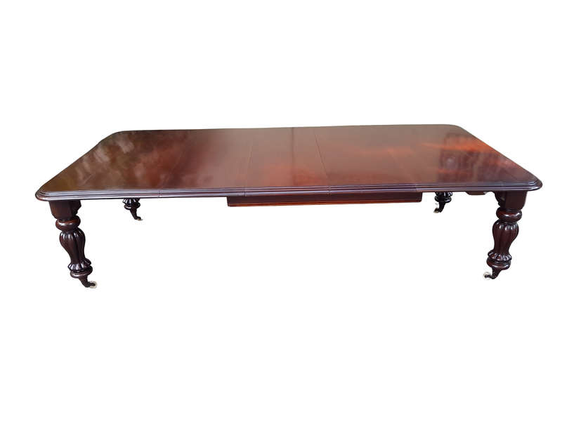 An Antique Victorian Mahogany Dining Table on Porcelain Castors with Three x Leaves and Crank Handle