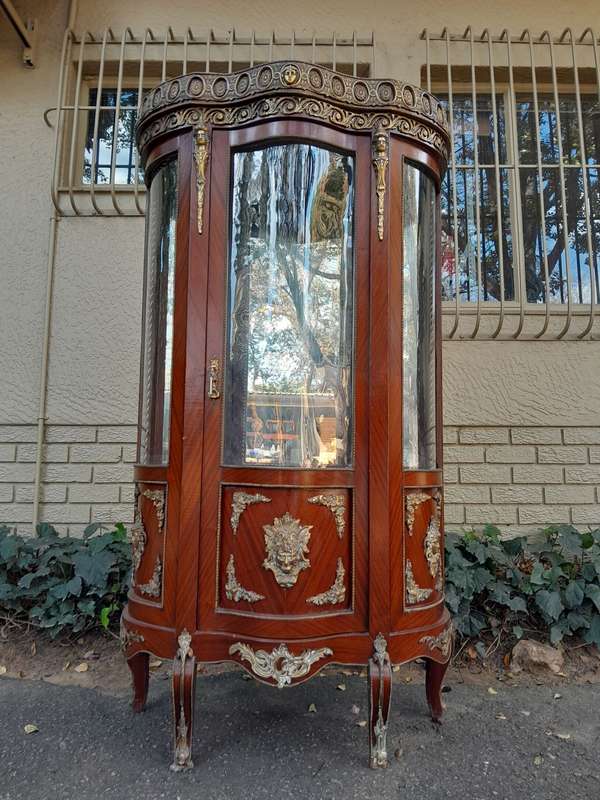 An Antique 20th Century French Ornate Style Mahogany Vitrine with Metal Mounts