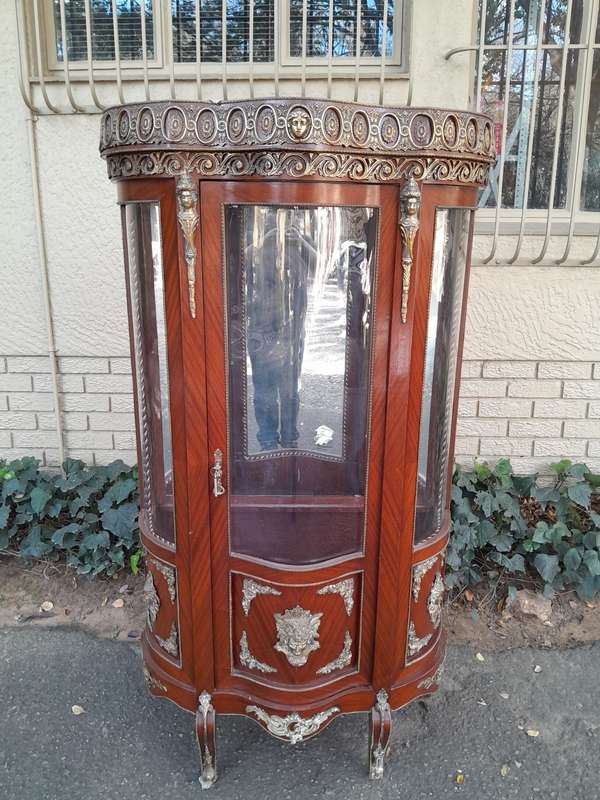An Antique 20th Century French Ornate Style Mahogany Vitrine with Metal Mounts