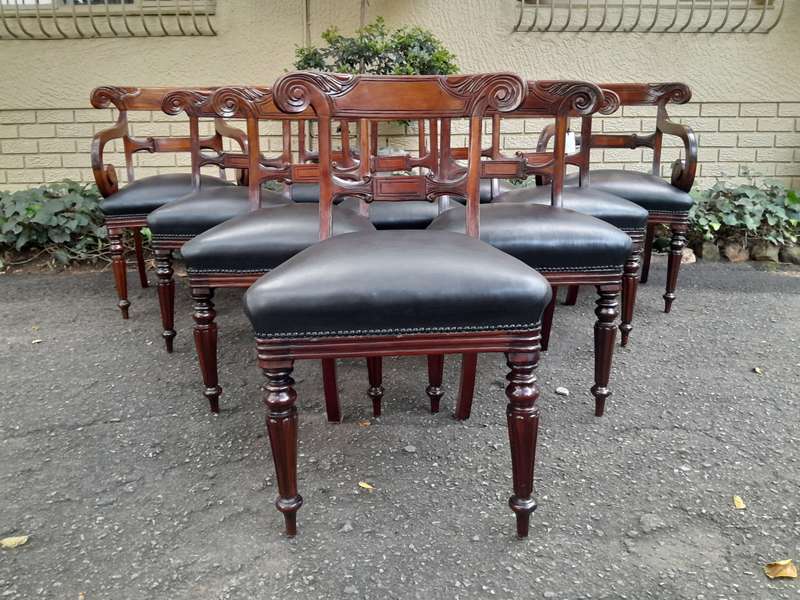 A 20th Century Set of Ten (10) William IV Style Mahogany Dining Chairs Consisting a Pair of Carve...