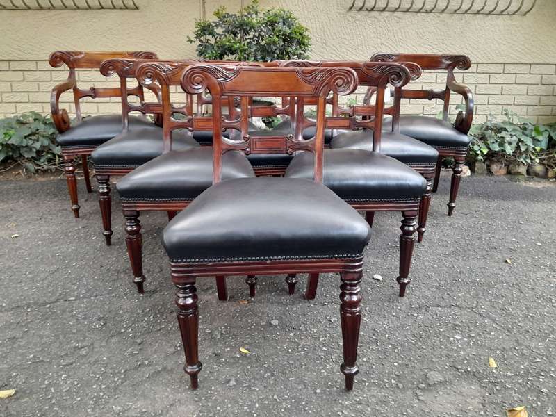 A 20th Century Set of Ten (10) William IV Style Mahogany Dining Chairs Consisting a Pair of Carve...