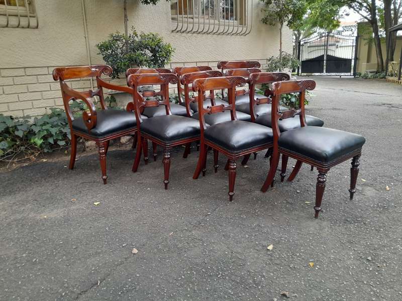 A 20th Century Set of Ten (10) William IV Style Mahogany Dining Chairs Consisting a Pair of Carve...