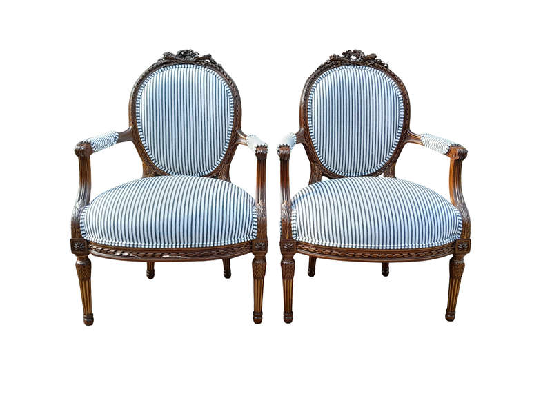 A 20th Century French Pair Of Gilded Mahogany Arm Chairs Upholstered In A Ticking Fabric 