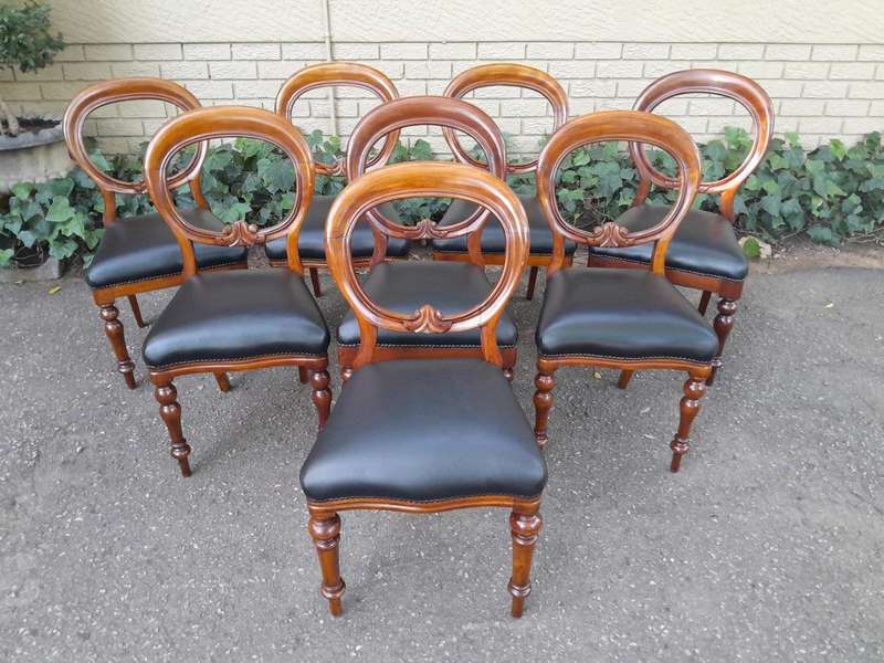 A 20th Century Set of Eight Victorian Style Mahogany Dining Chairs Upholstered in Leather
