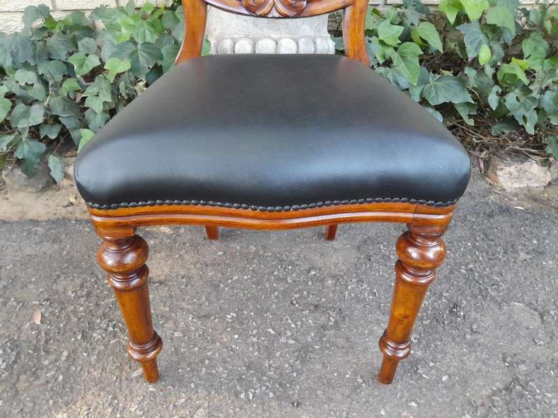A 20th Century Set of Eight Victorian Style Mahogany Dining Chairs Upholstered in Leather