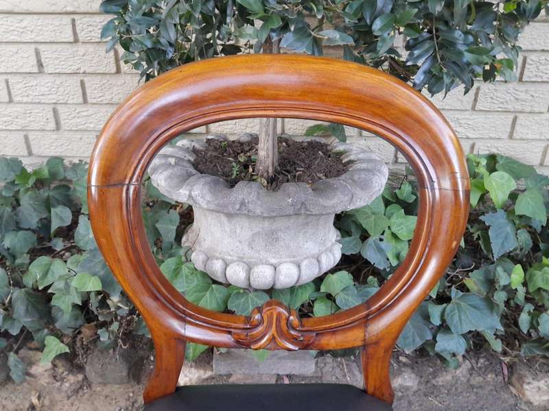 A 20th Century Set of Eight Victorian Style Mahogany Dining Chairs Upholstered in Leather