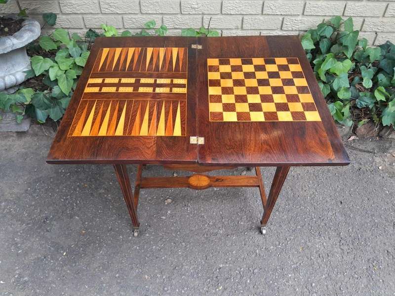 An Antique Edwardian Rosewood And Inlaid Chess / Games Table on Castors
