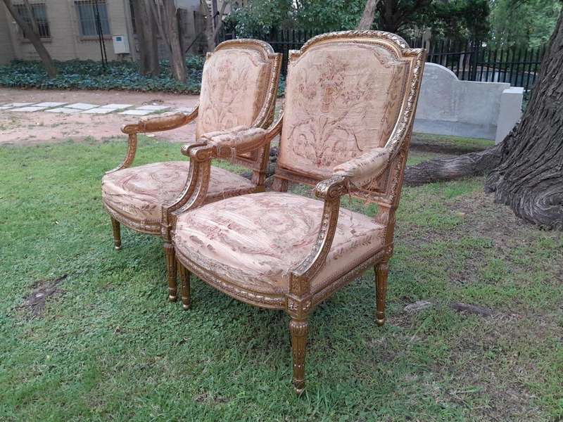 A 20th Century French Pair of Gilded Armchairs