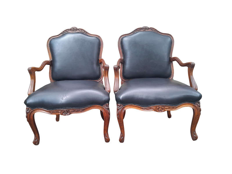 A 20th Century Pair or Carved Mahogany Armchairs Upholstered In Leather