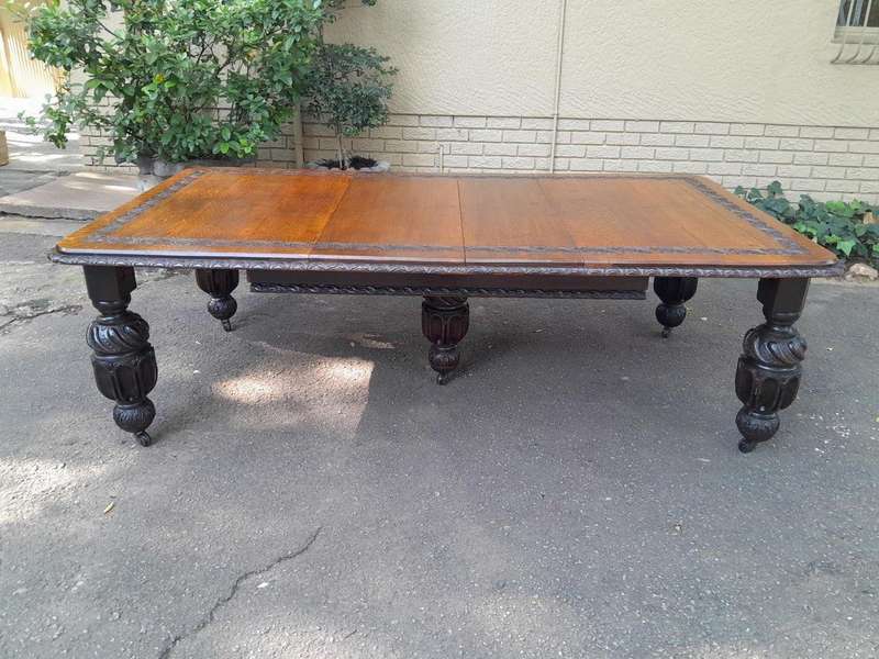 A Massive Antique 19th Century English Heavily Carved Extending Table With Crank Handle