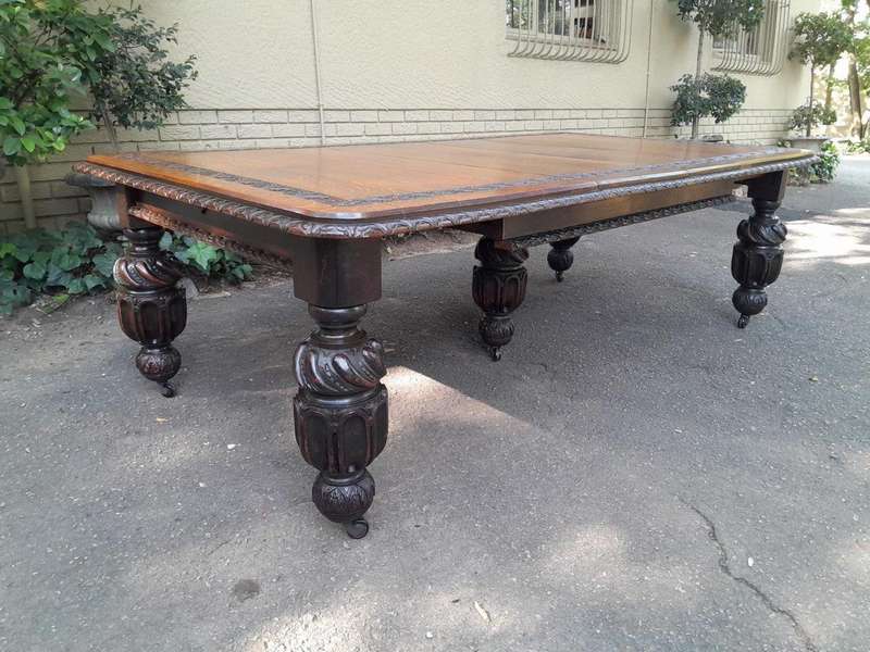 A Massive Antique 19th Century English Heavily Carved Extending Table With Crank Handle