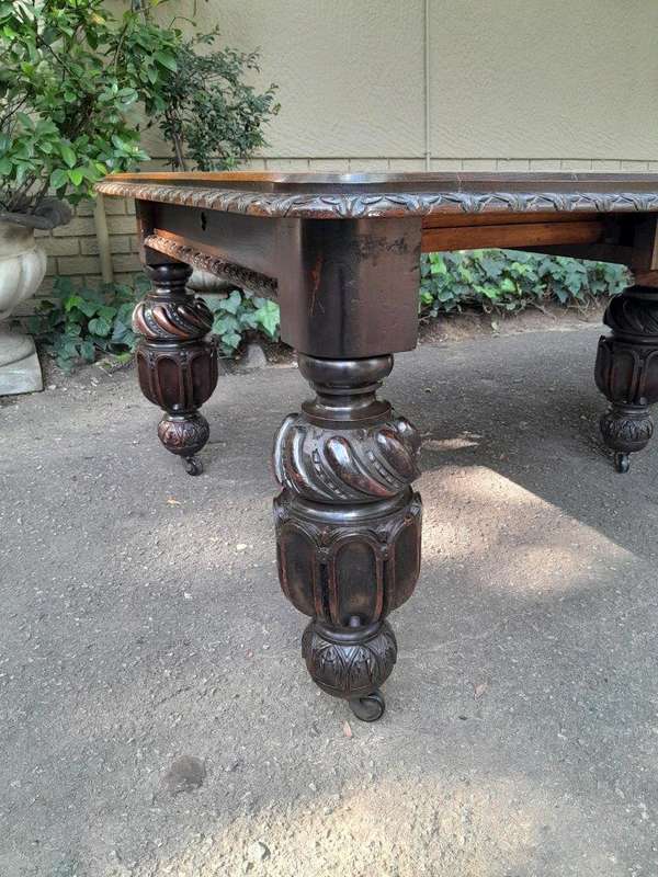 A Massive Antique 19th Century English Heavily Carved Extending Table With Crank Handle