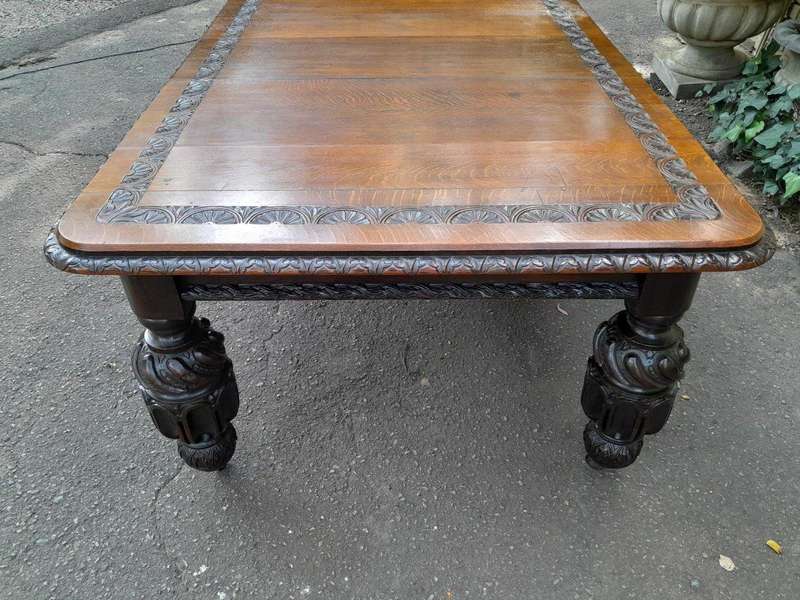 A Massive Antique 19th Century English Heavily Carved Extending Table With Crank Handle
