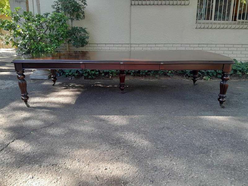 An Antique and Massive Victorian Mahogany Extending Table with Two Extensions and Original Castor...