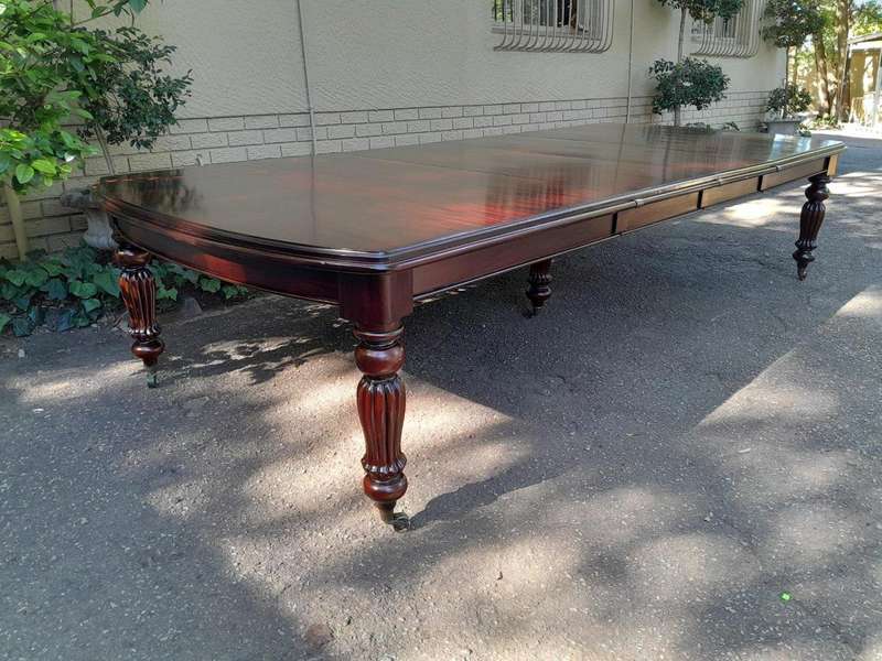 An Antique and Massive Victorian Mahogany Extending Table with Two Extensions and Original Castor...
