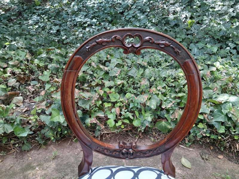 An Antique Victorian Walnut Set of Six Ornately Carved Chairs