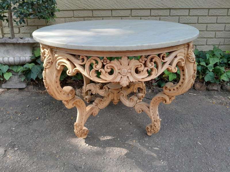 A20th Century Rococo Style Heavily Carved Teak Table with White Marble Top in a Contemporary Blea...