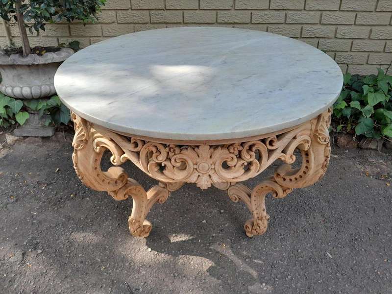 A20th Century Rococo Style Heavily Carved Teak Table with White Marble Top in a Contemporary Blea...