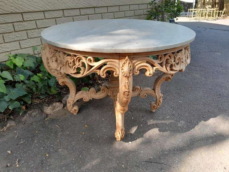 A20th Century Rococo Style Heavily Carved Teak Table with White Marble Top in a Contemporary Blea...