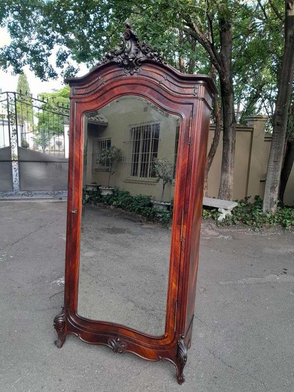 An Early 20th Century French Carved Rosewood Armoire with Bevelled Mirror and Lock and Key