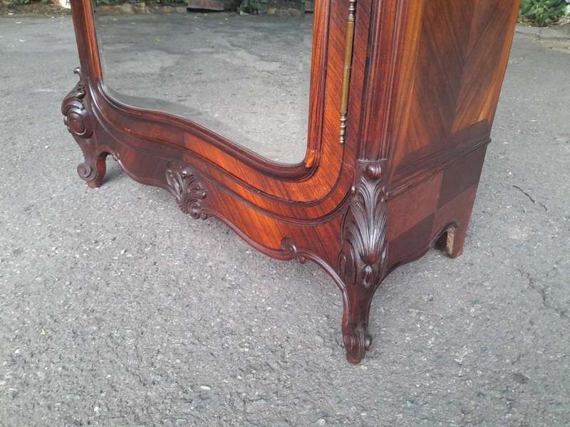 An Early 20th Century French Carved Rosewood Armoire with Bevelled Mirror and Lock and Key